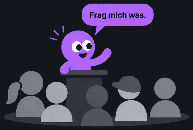 Bloop steht am Pult vor einer Klasse und sagt: Frag mich was.